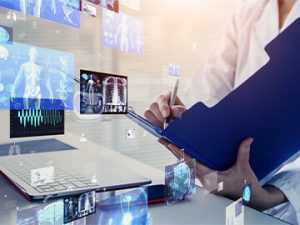 hands documenting health information in chart