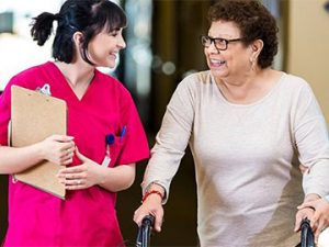 medical professional walks in hallway with patient