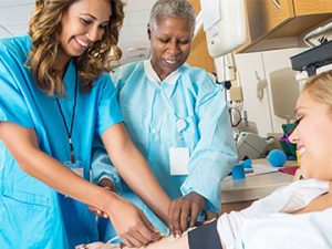two medical professionals placing an iv drip on patient