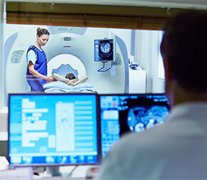 tech helping patient with mri