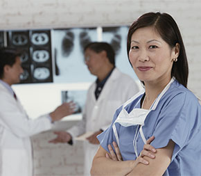 woman technician in front of scan results
