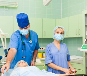 techs prepping patient for surgery