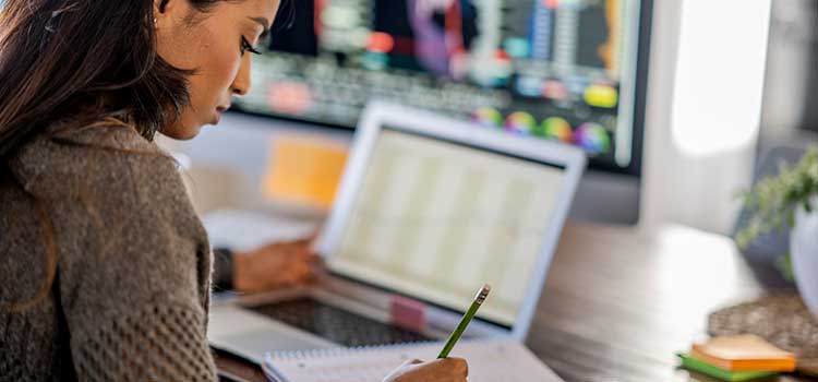 woman taking certification test on laptop
