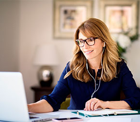 professional at home office works on laptop