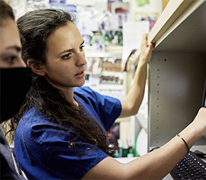 xray tech looks over scans with nurse