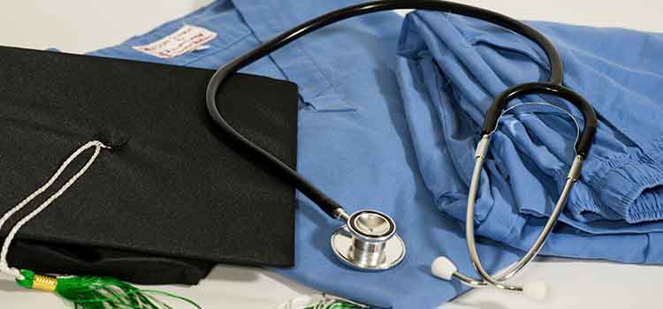 graduation cap and medical scrubs