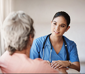 medical assistant reassures elderly patient