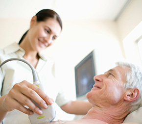 cardiovascular tech gives patient an echocardiogram