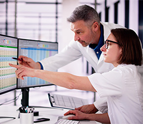 medical billing and coding student gets tips about codes from instructor