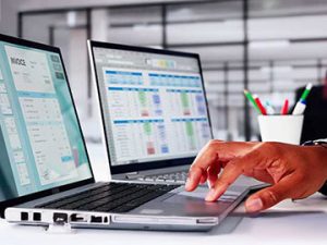 medical coder implements value-based care while inputting codes into computer