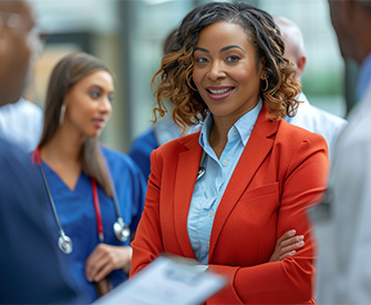 healthcare administrator impromptu meets with healthcare workers in busy california hospital