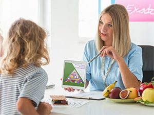 nutritionist explains healthy eating to teen with eating disorder