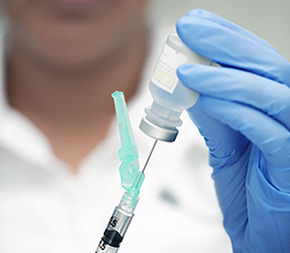 medical assistant prepping a shot